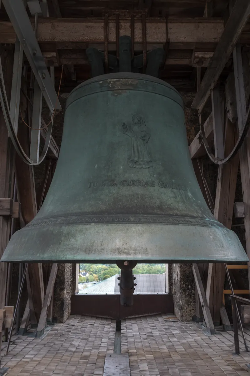 The large Salvator bell hanging in a timber frame in a tower of Salzburg Cathedral